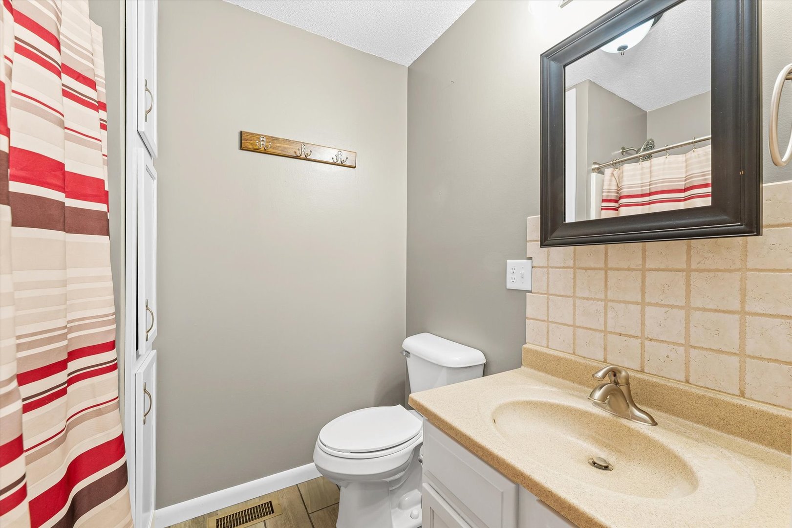 211 North Center Street Melvin, IL 60952 - Photo 21 of 26 a bathroom with a sink and a mirror