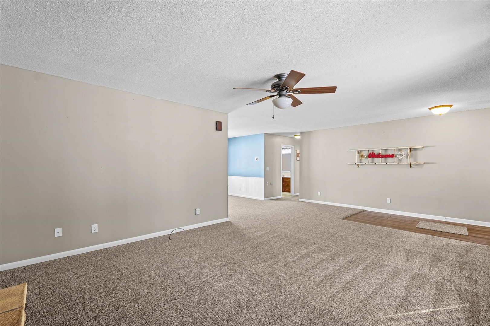 211 North Center Street Melvin, IL 60952 - Photo 5 of 26 a view of a livingroom with a ceiling fan and window
