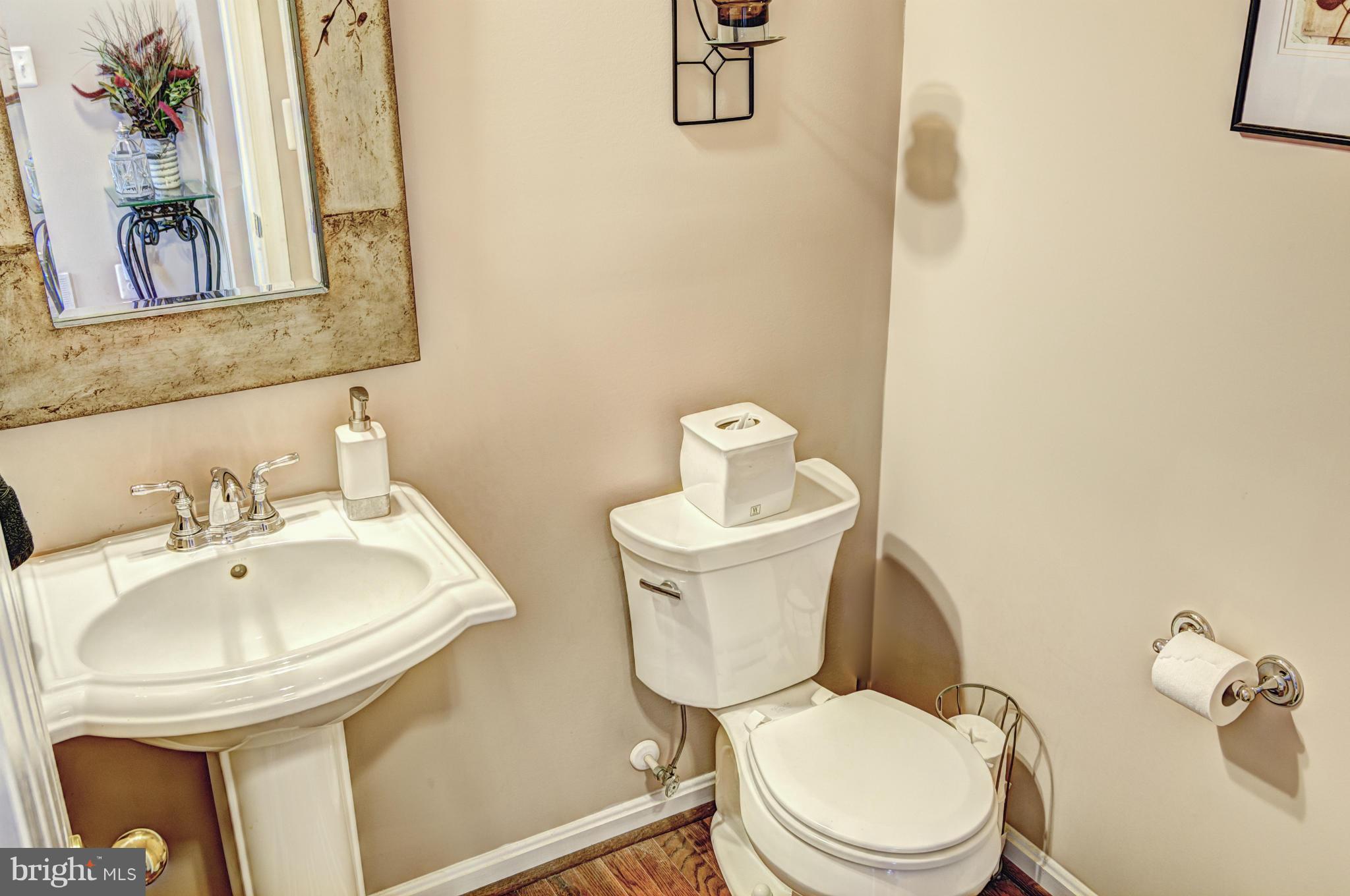 2106 Baythorne Road Prince Frederick, MD 20678 - Photo 15 of 30 a white toilet sitting next to a bathroom sink