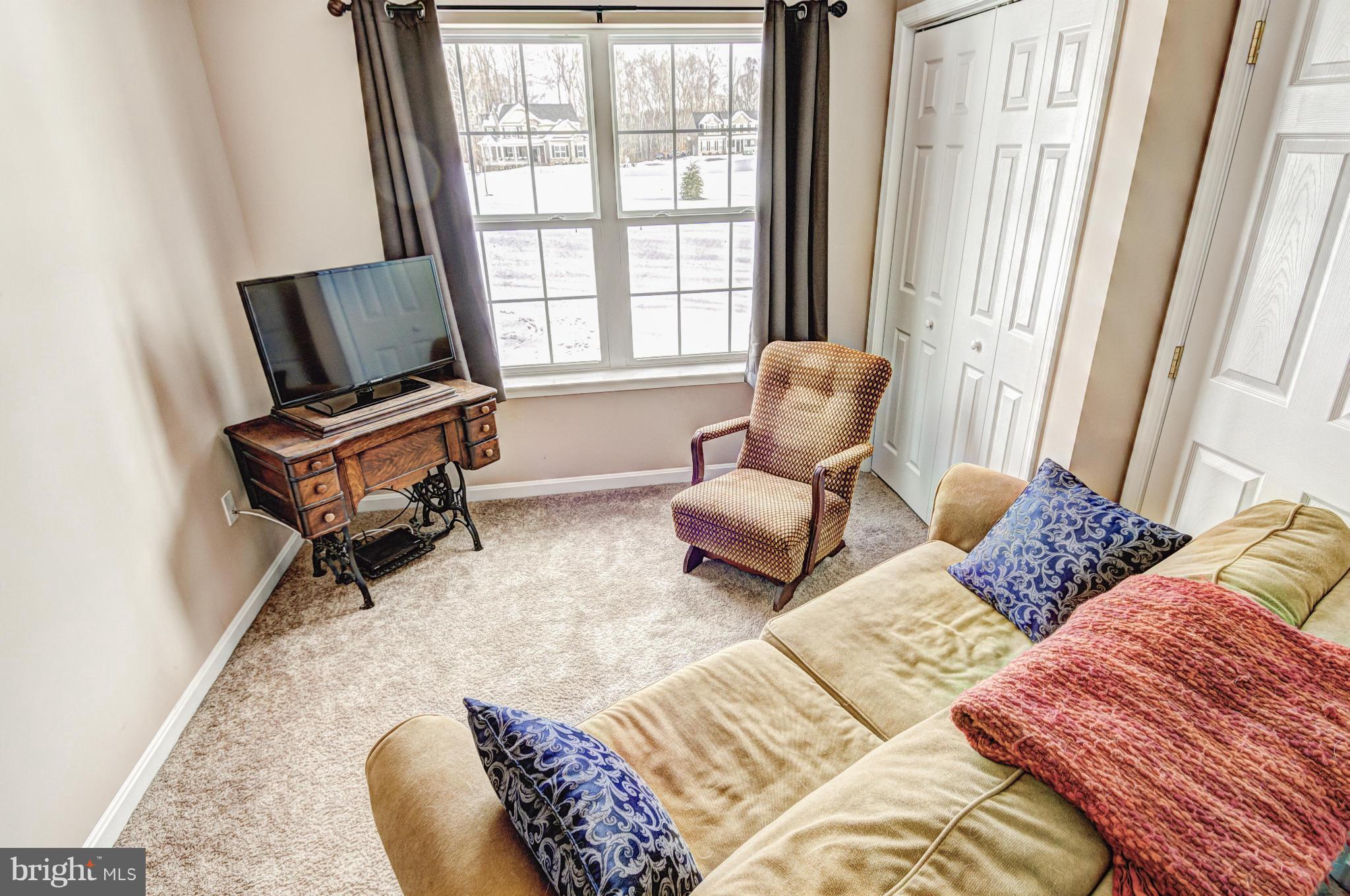 2106 Baythorne Road Prince Frederick, MD 20678 - Photo 19 of 30 a living room with furniture and a window