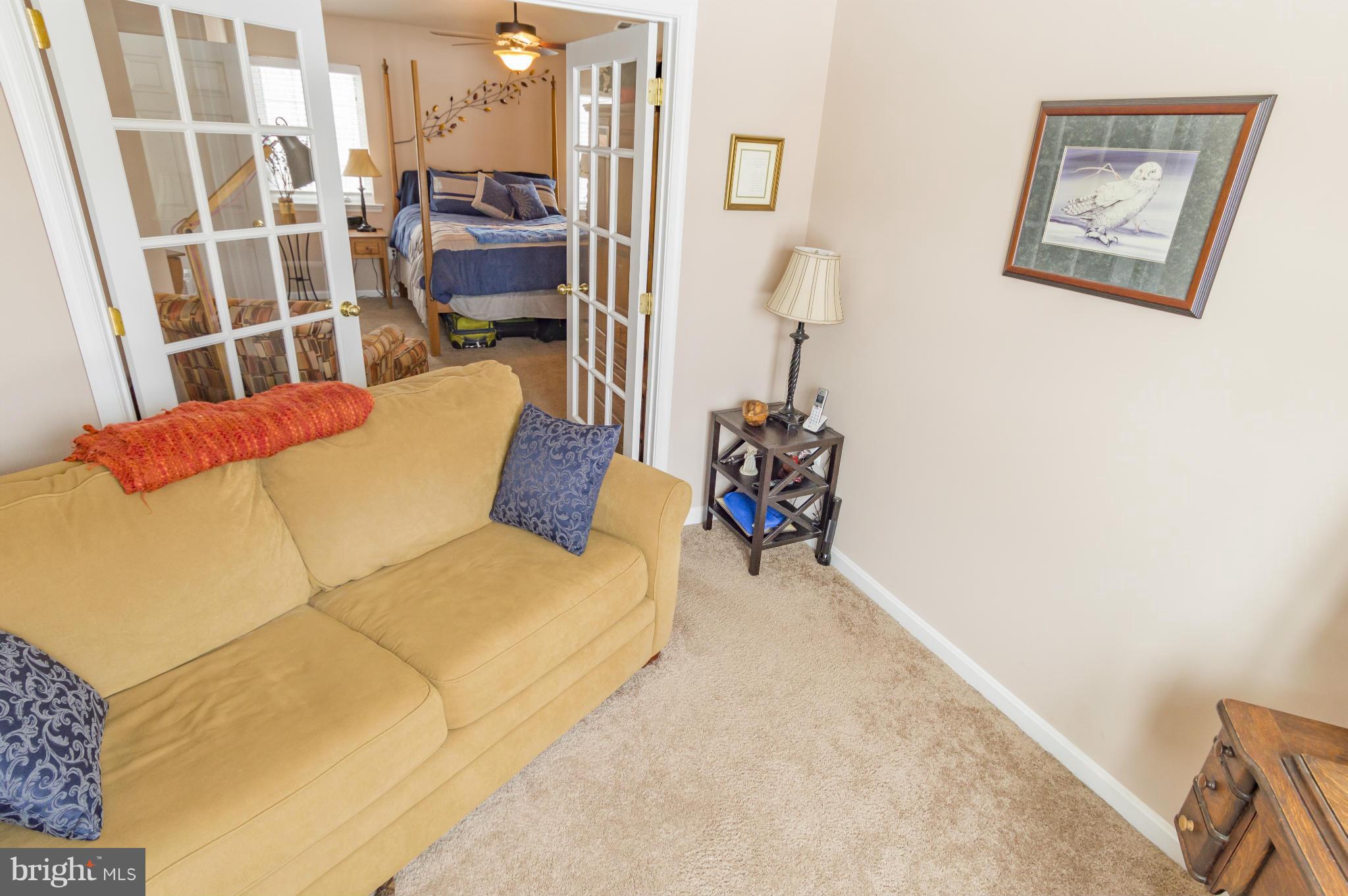 2106 Baythorne Road Prince Frederick, MD 20678 - Photo 20 of 30 a view of a bedroom with a bed and furniture