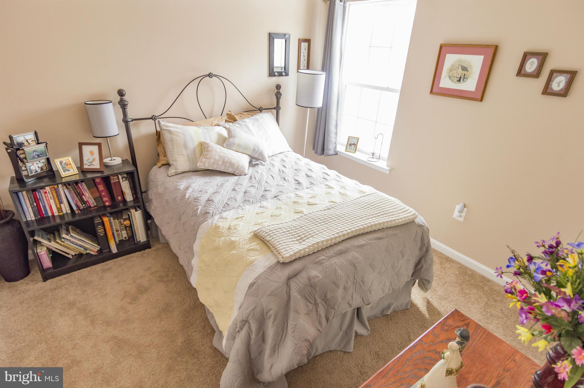 2106 Baythorne Road Prince Frederick, MD 20678 - Photo 22 of 30 a bedroom with a bed and a window
