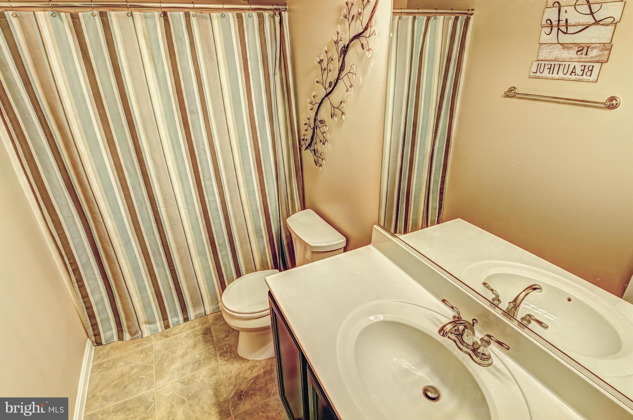 2106 Baythorne Road Prince Frederick, MD 20678 - Photo 23 of 30 a close view of a sink and a washer and dryer
