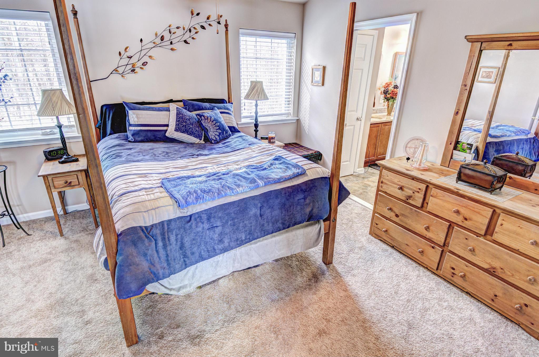 2106 Baythorne Road Prince Frederick, MD 20678 - Photo 8 of 30 a bedroom with a large bed and a flat tv screen on dresser
