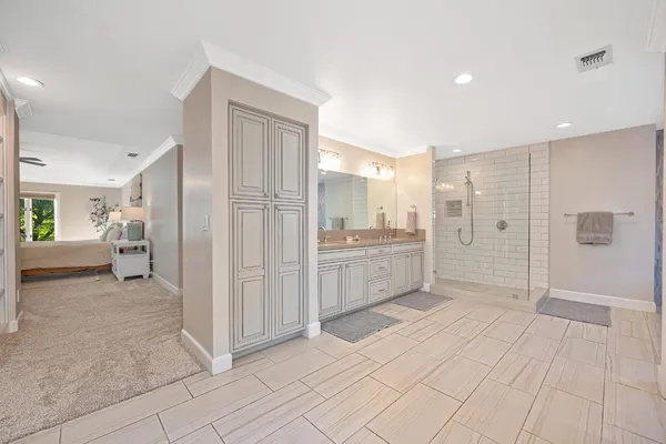a bathroom with a shower and a sink