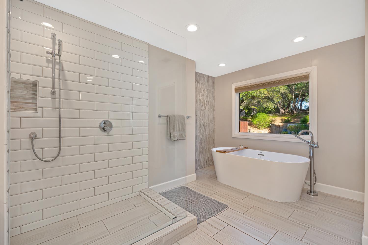 4911 Lexington Circle Loomis, CA 95650 - Photo 17 of 48 a bathroom with a tub a window and a shower