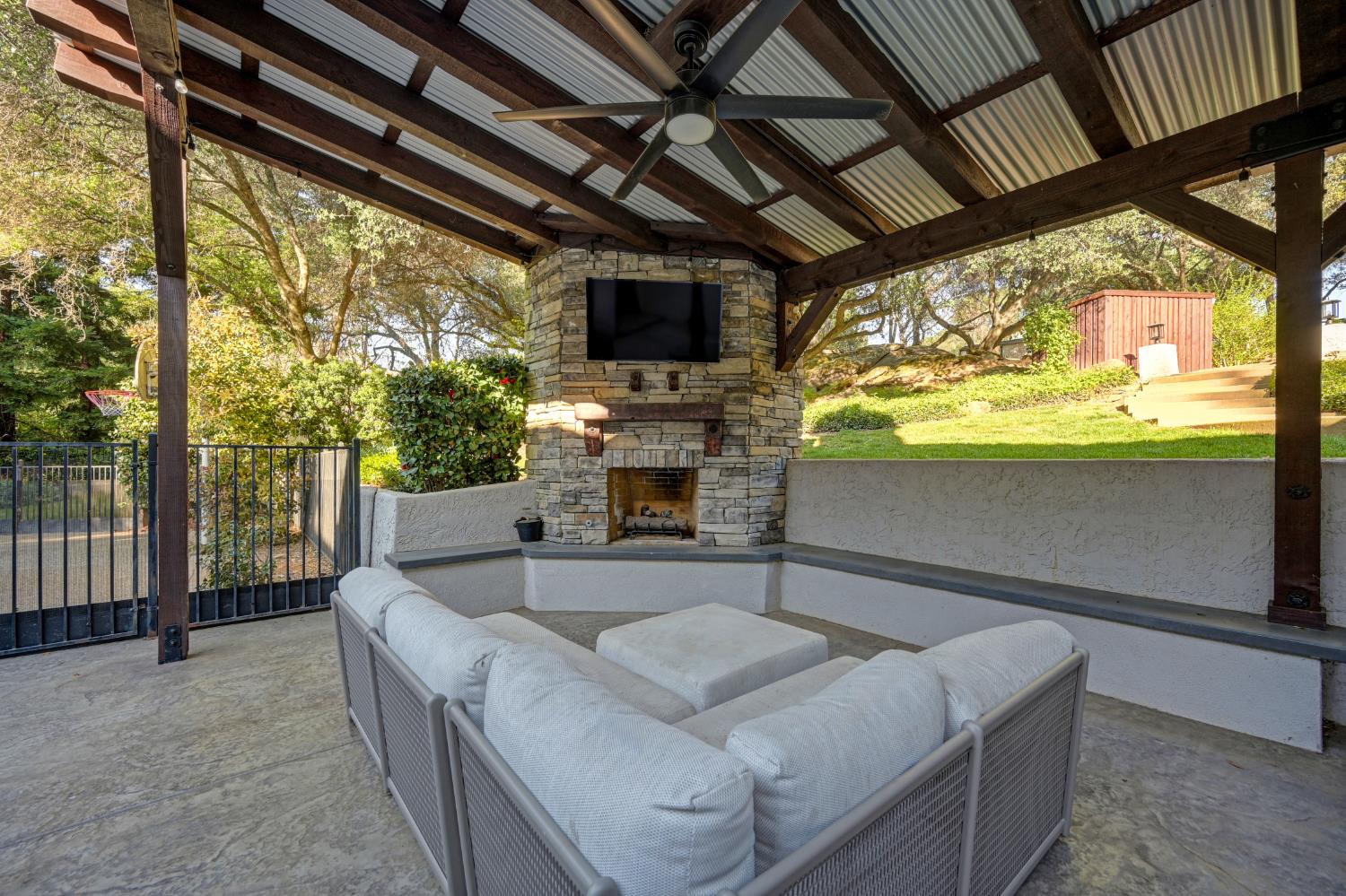 4911 Lexington Circle Loomis, CA 95650 - Photo 30 of 48 a living room with fireplace furniture and a flat screen tv