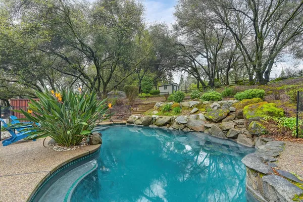 a view of swimming pool with a yard
