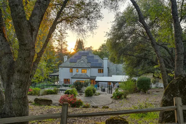 a front view of a house with garden
