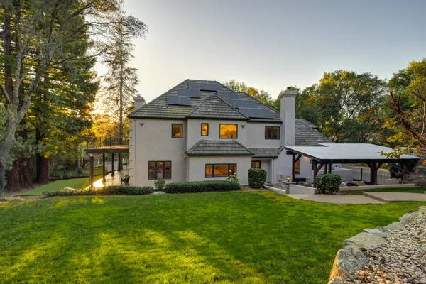 a view of a building with a backyard