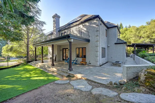 a view of yard with patio and outdoor seating