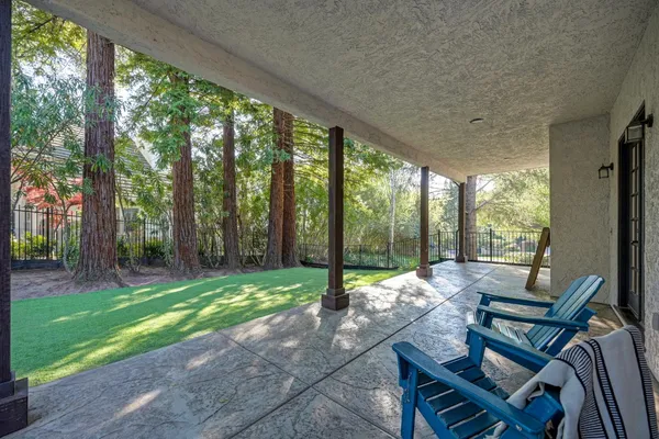 an aerial view of house with backyard