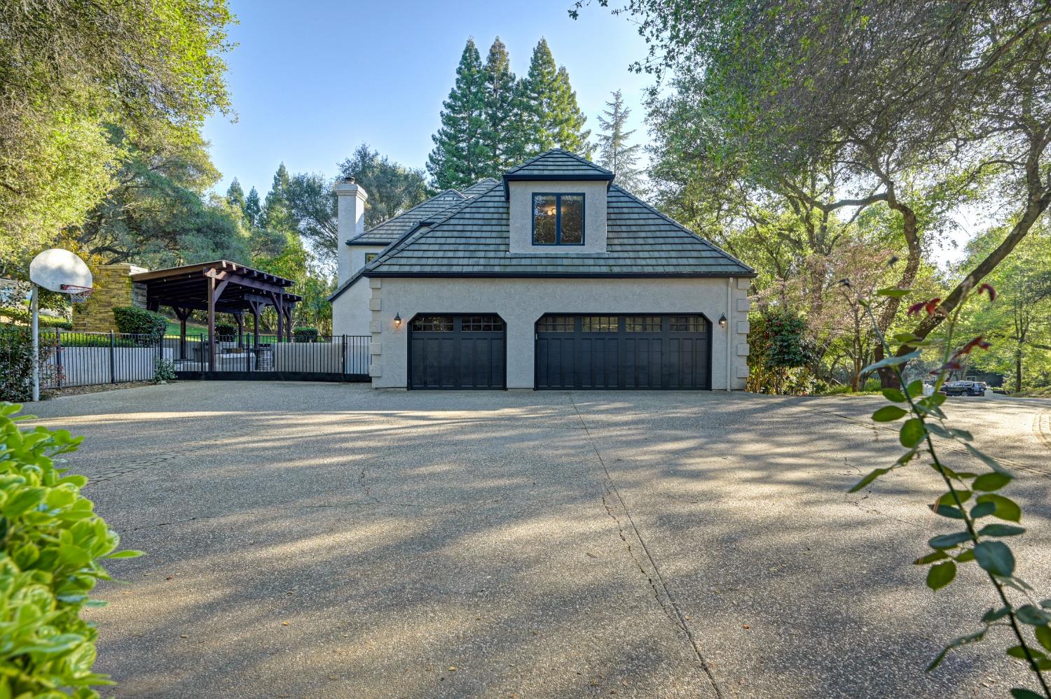 4911 Lexington Circle Loomis, CA 95650 - Photo 44 of 48 a front view of a house with a yard and garage