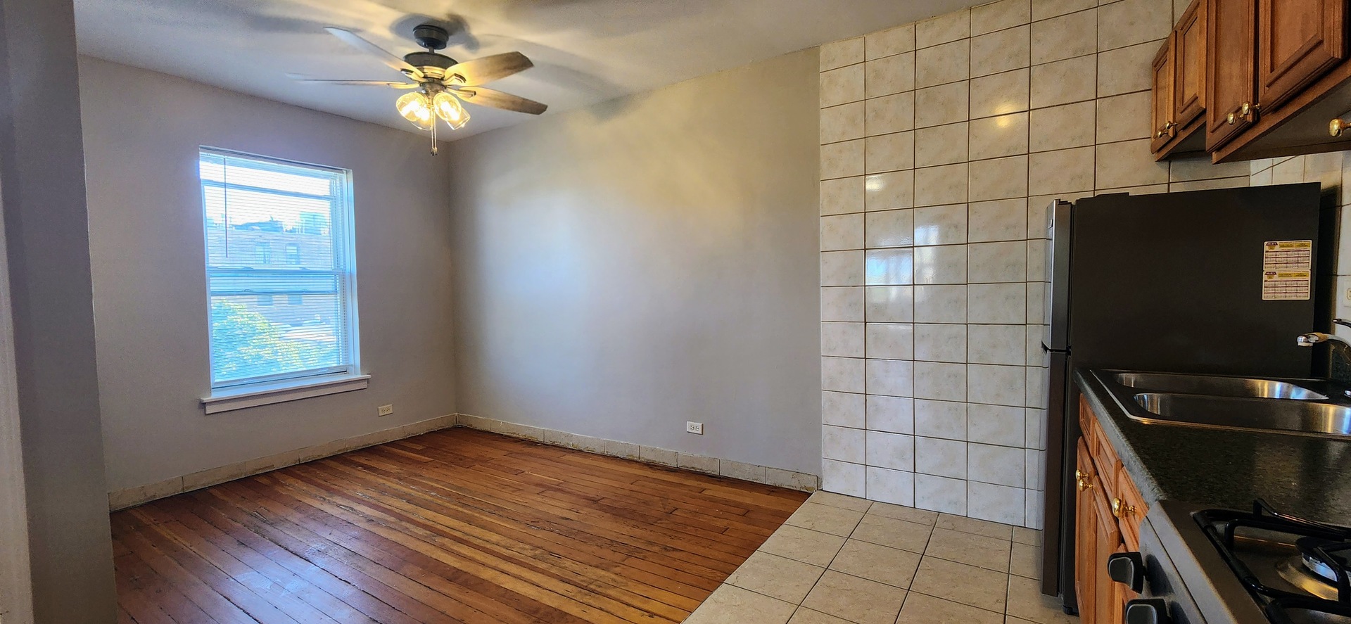 4764 North Virginia Avenue, Unit 206 Chicago, IL 60625 - Photo 3 of 16 a view of a workspace with wooden floor and a window