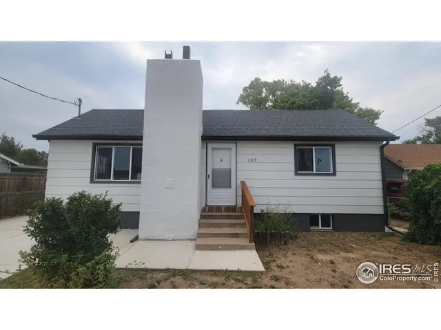 a black and white photo of a house