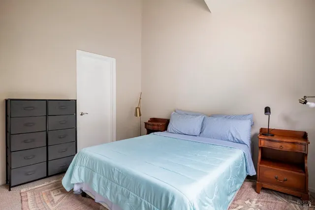 a bedroom with a bed and a closet