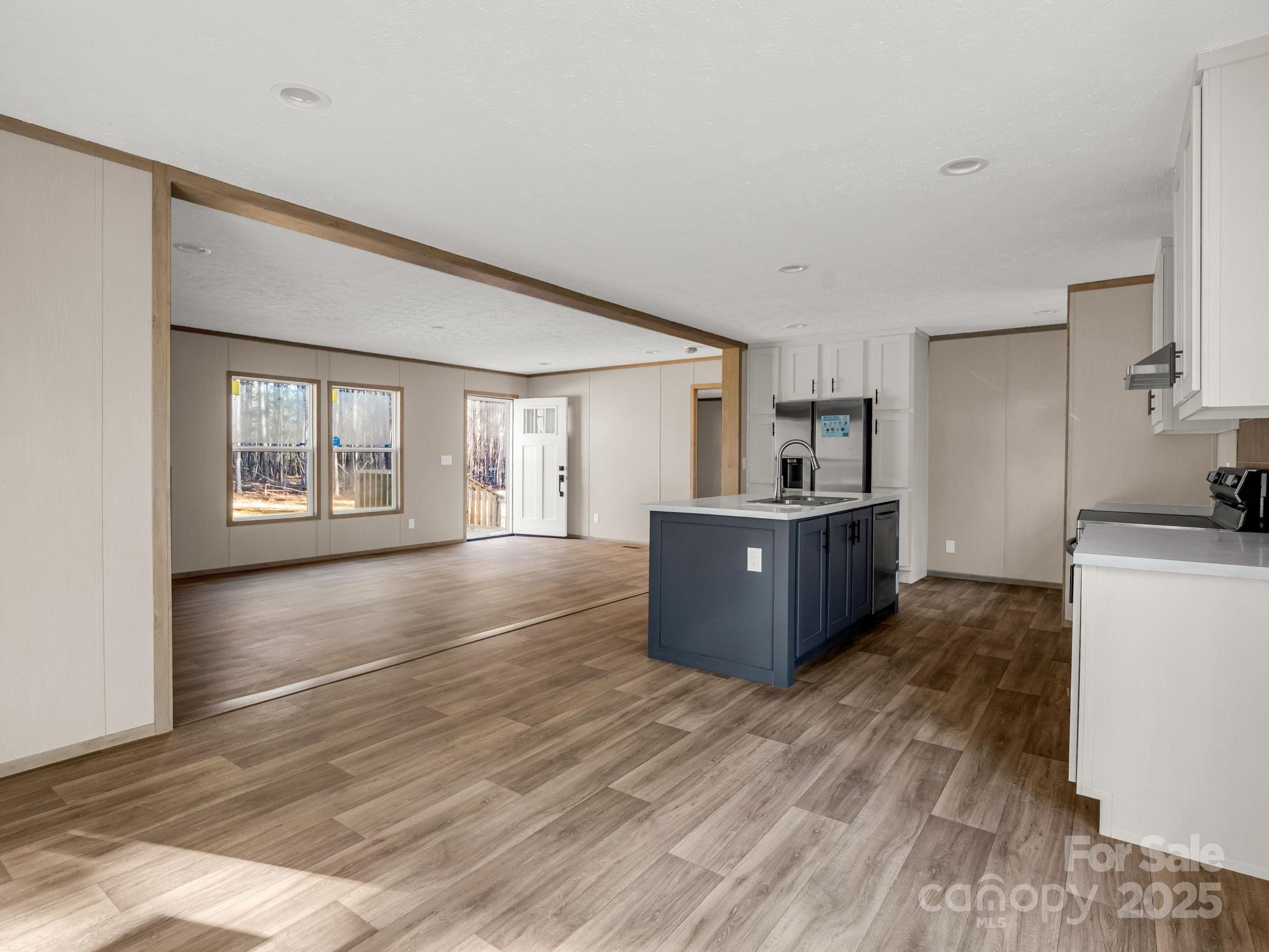 864 Tiney Road Ellenboro, NC 28040 - Photo 14 of 33 a kitchen with stainless steel appliances kitchen island a large counter top and a wooden floors
