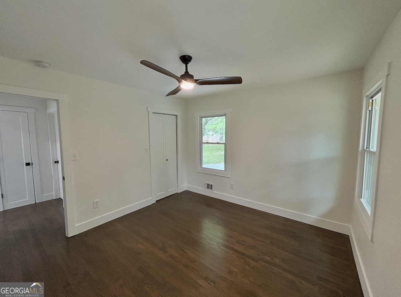 1742 Constitution Road Southeast Atlanta, GA 30316 - Photo 16 of 32 a view of an empty room with wooden floor and a window