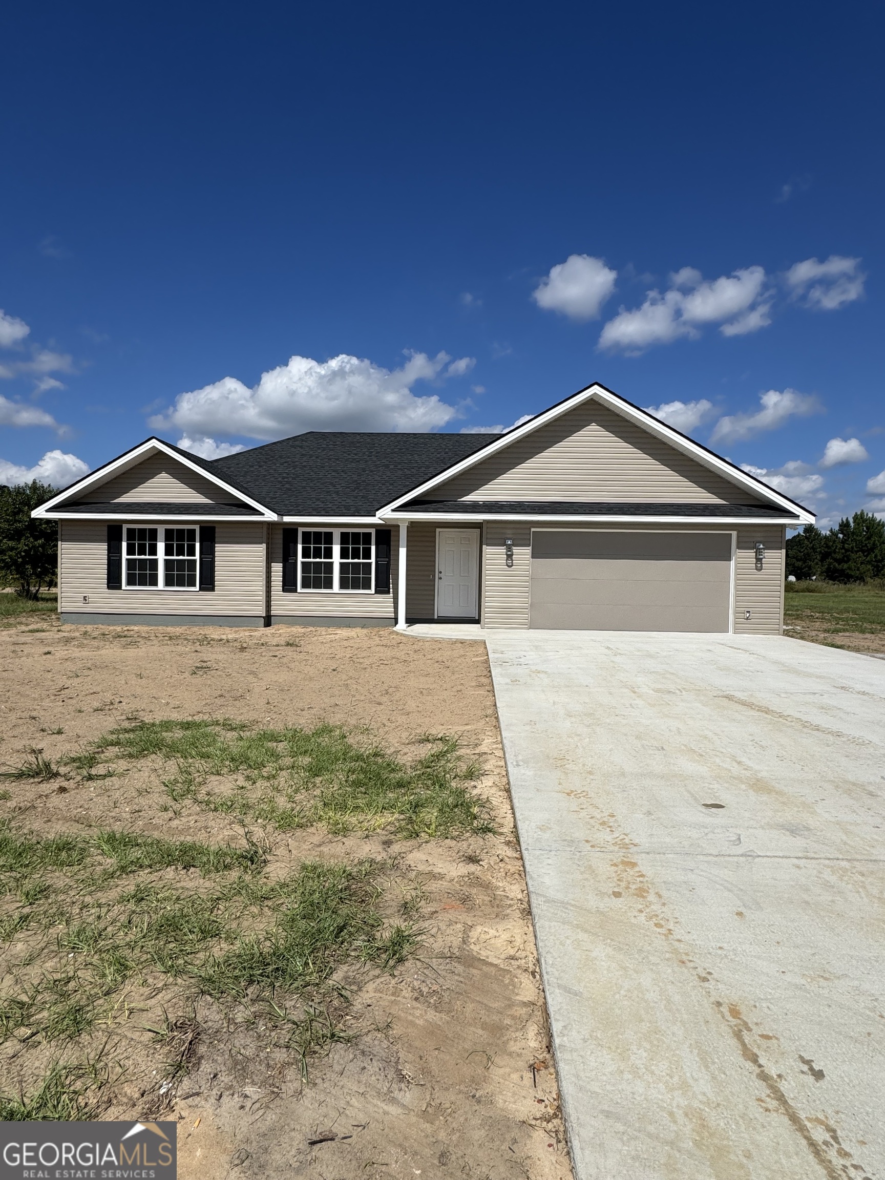 60 Manassas Station Road Collins, GA 30417 - Photo 1 of 1 a front view of a house with a yard