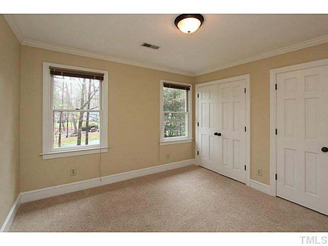 2700 Mattlyn Court Raleigh, NC 27613 - Photo 15 of 25 New paint, carpet, light fixture, double closet. Bedroom