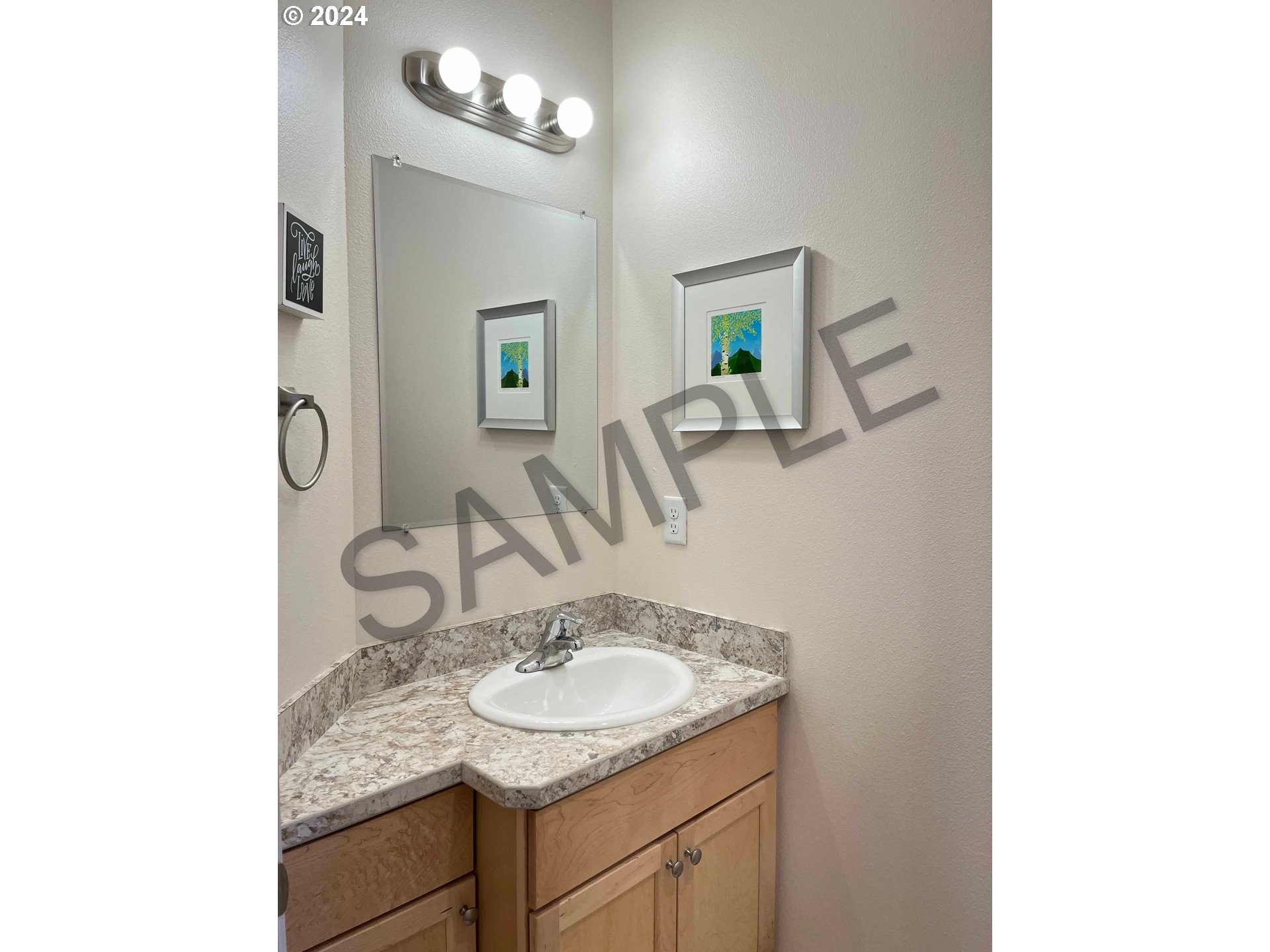 1593 37th Street Florence, OR 97439 - Photo 21 of 48 a bathroom with a sink and a mirror