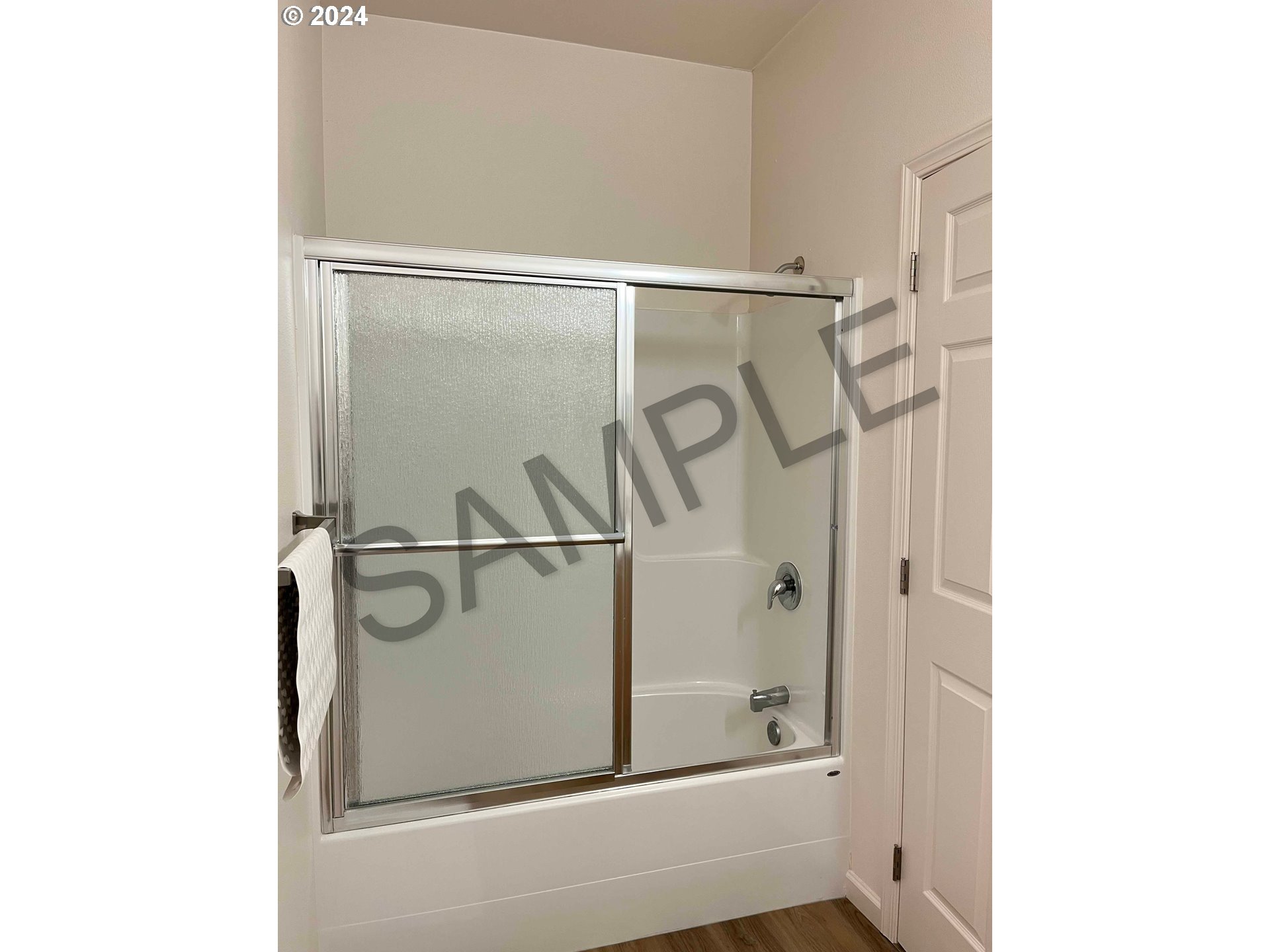 1593 37th Street Florence, OR 97439 - Photo 39 of 48 a bathroom with a glass shower door