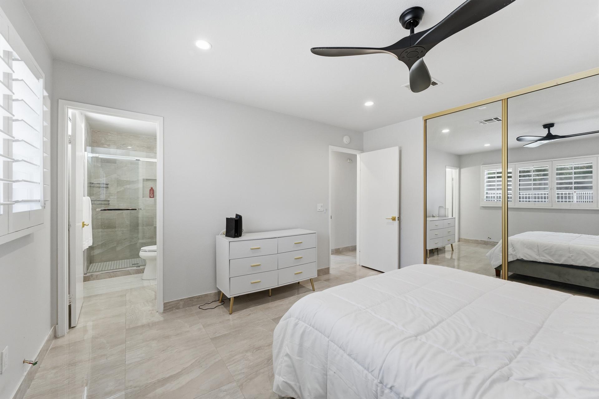 40961 Cecina Way Bermuda Dunes, CA 92203 - Photo 15 of 27 a bedroom with a bed and a chandelier