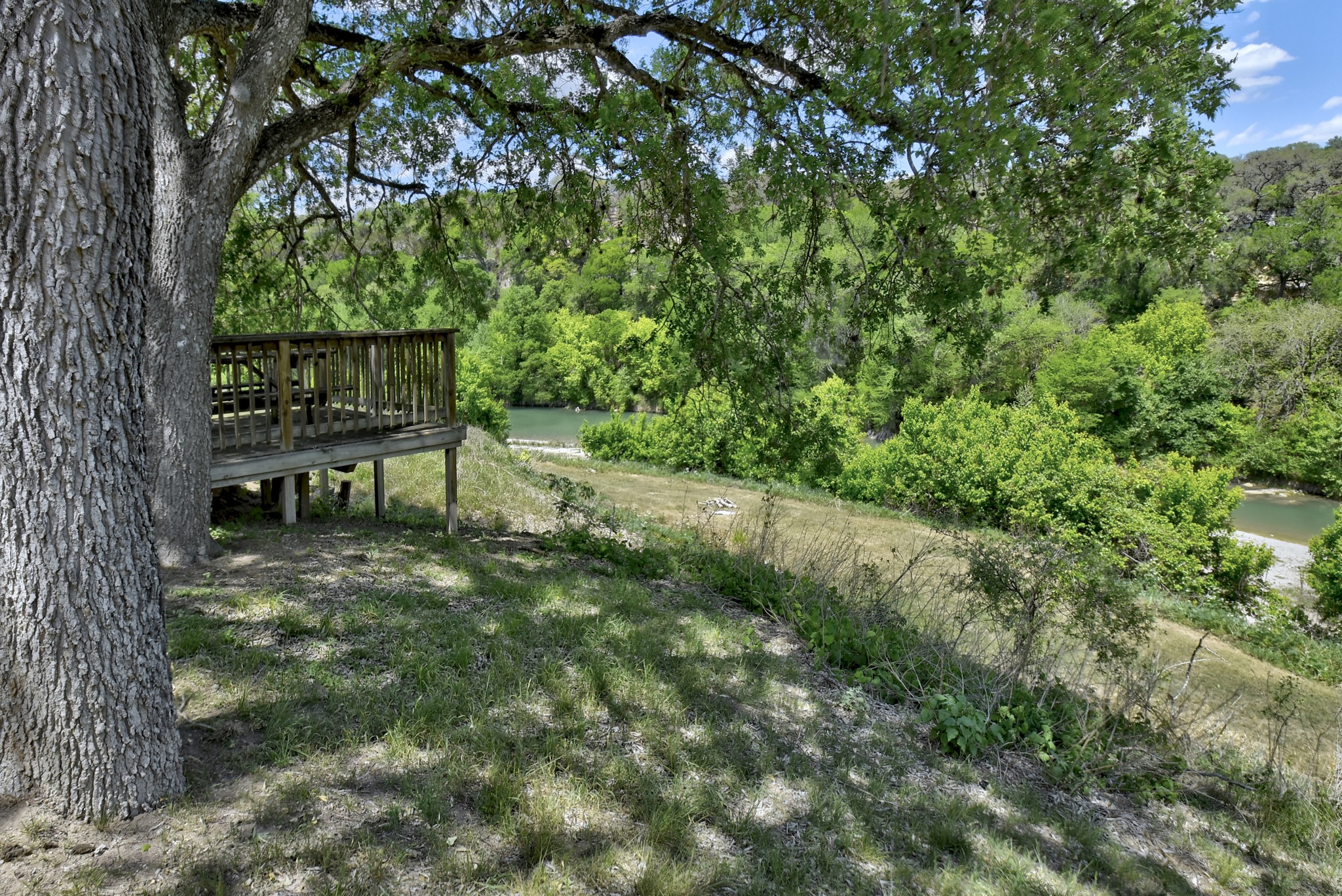 1170 Misty Lane Spring Branch, TX 78070 - Photo 17 of 24 Perched above the river, a private deck invites serene outdoor living.