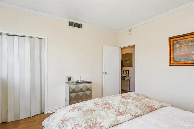 a bedroom with a bed and a closet