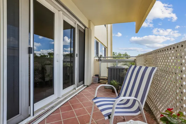 a view of balcony with furniture