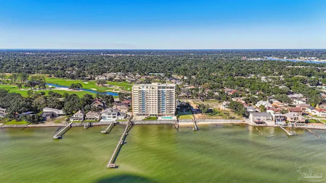 a view of a swimming pool with chair and table