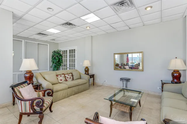 a view of a dining room with furniture and window