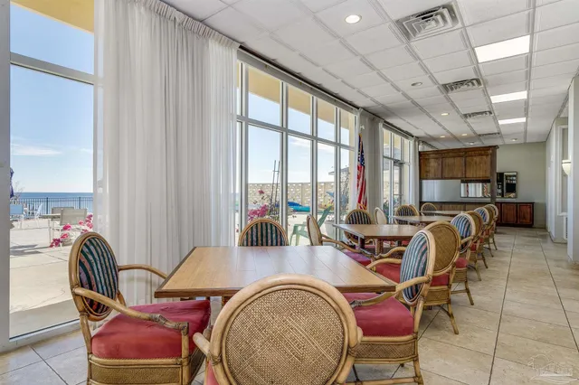 a living room filled with furniture and a flat screen tv