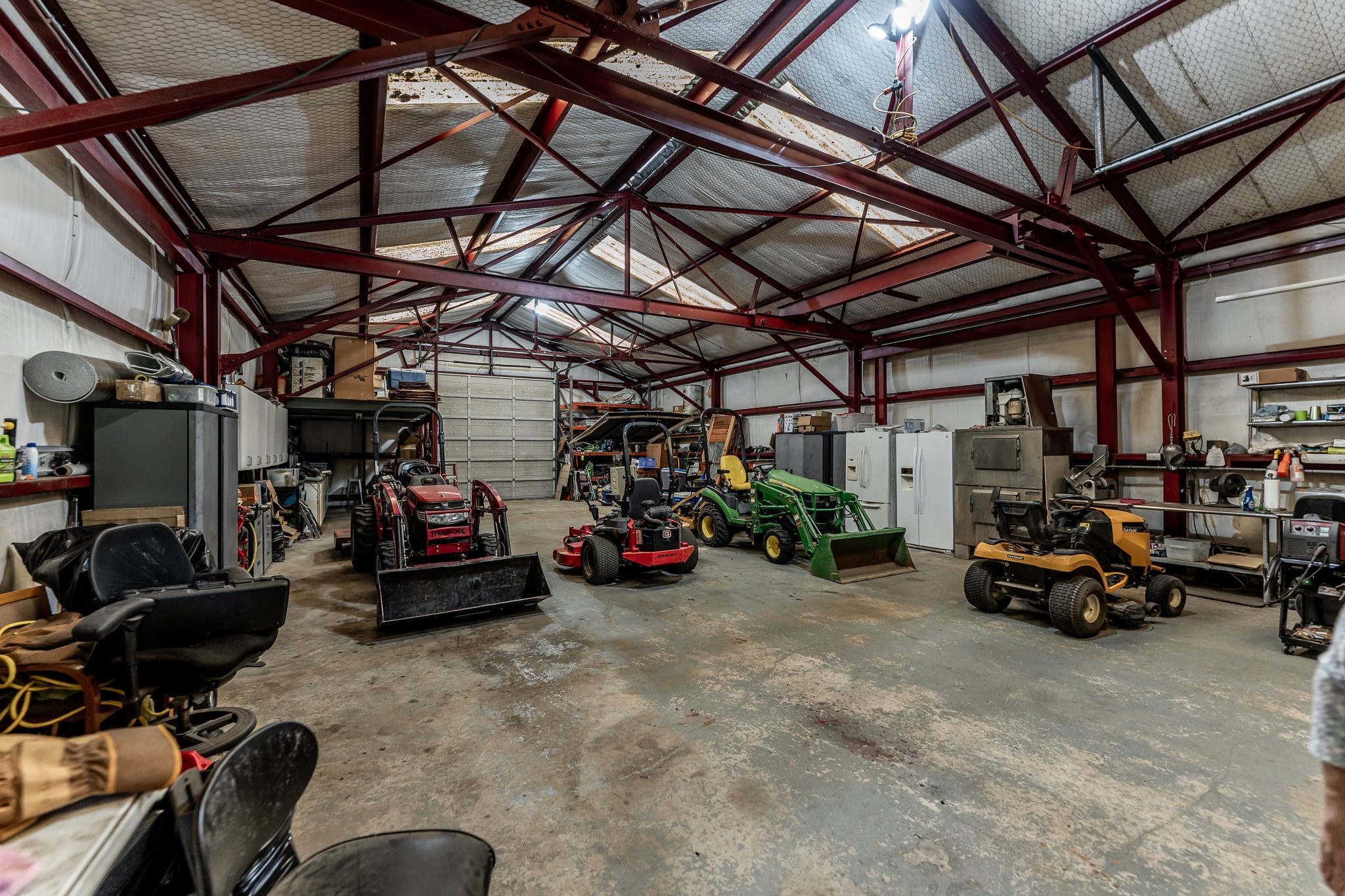 13334 Fultz Road Conroe, TX 77304 - Photo 30 of 49 a view of a garage with a bike and a car