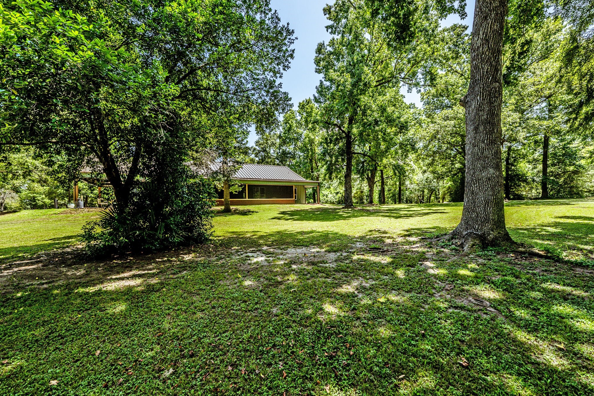 13334 Fultz Road Conroe, TX 77304 - Photo 43 of 49 a view of outdoor space with deck and garden