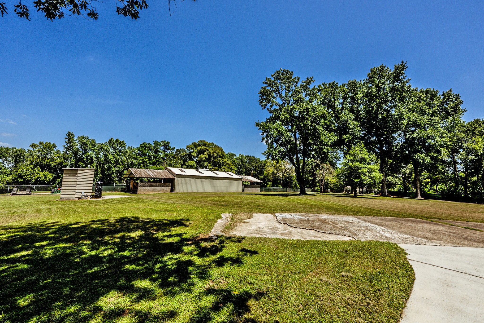 13334 Fultz Road Conroe, TX 77304 - Photo 45 of 49 a view of a golf course with a lake