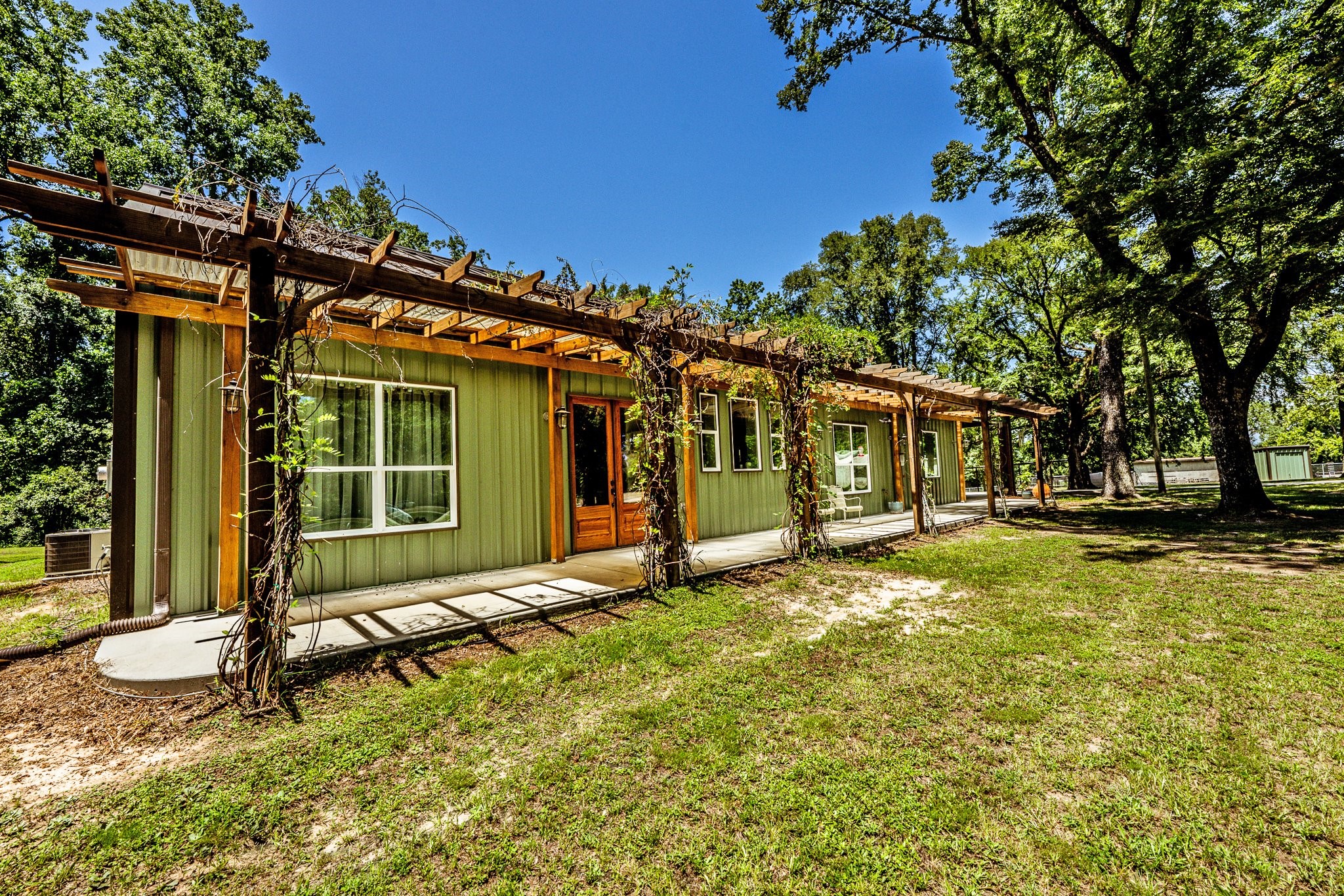 13334 Fultz Road Conroe, TX 77304 - Photo 47 of 49 a view of a house with a yard and sitting area