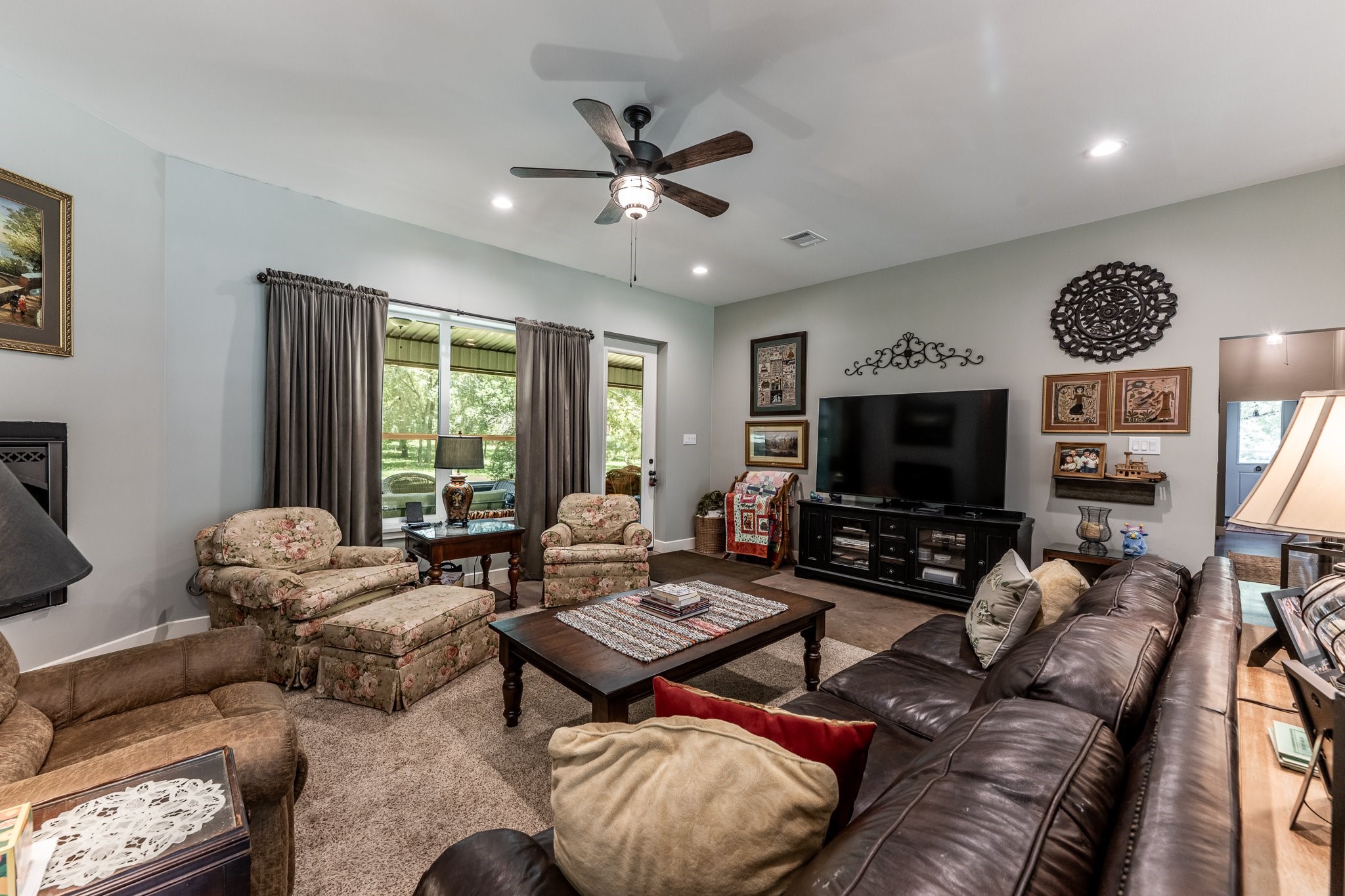 13334 Fultz Road Conroe, TX 77304 - Photo 7 of 49 a living room with furniture and a flat screen tv