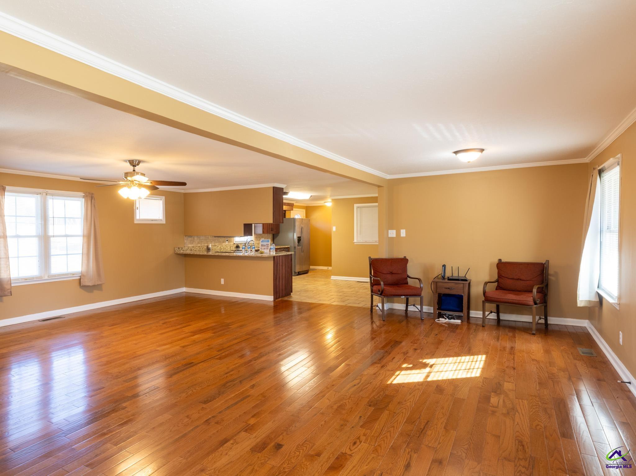 3491 Sandy Circle Macon, GA 31216 - Photo 6 of 47 a view of a livingroom with furniture window and wooden floor