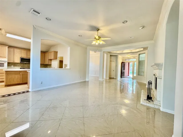a view of a livingroom with a kitchen