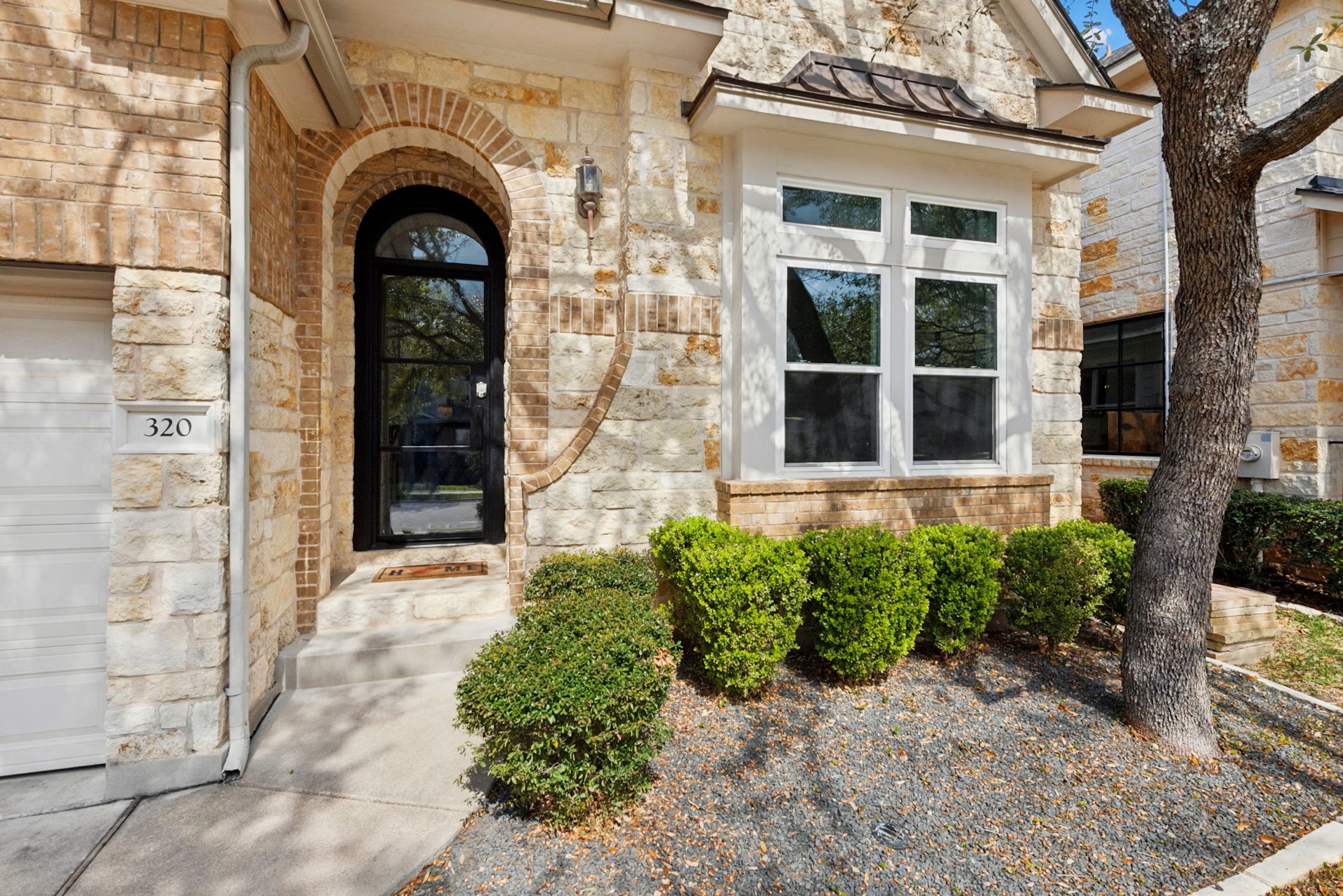 320 El Socorro Lane Austin, TX 78732 - Photo 4 of 40 a view of building with glass windows and door