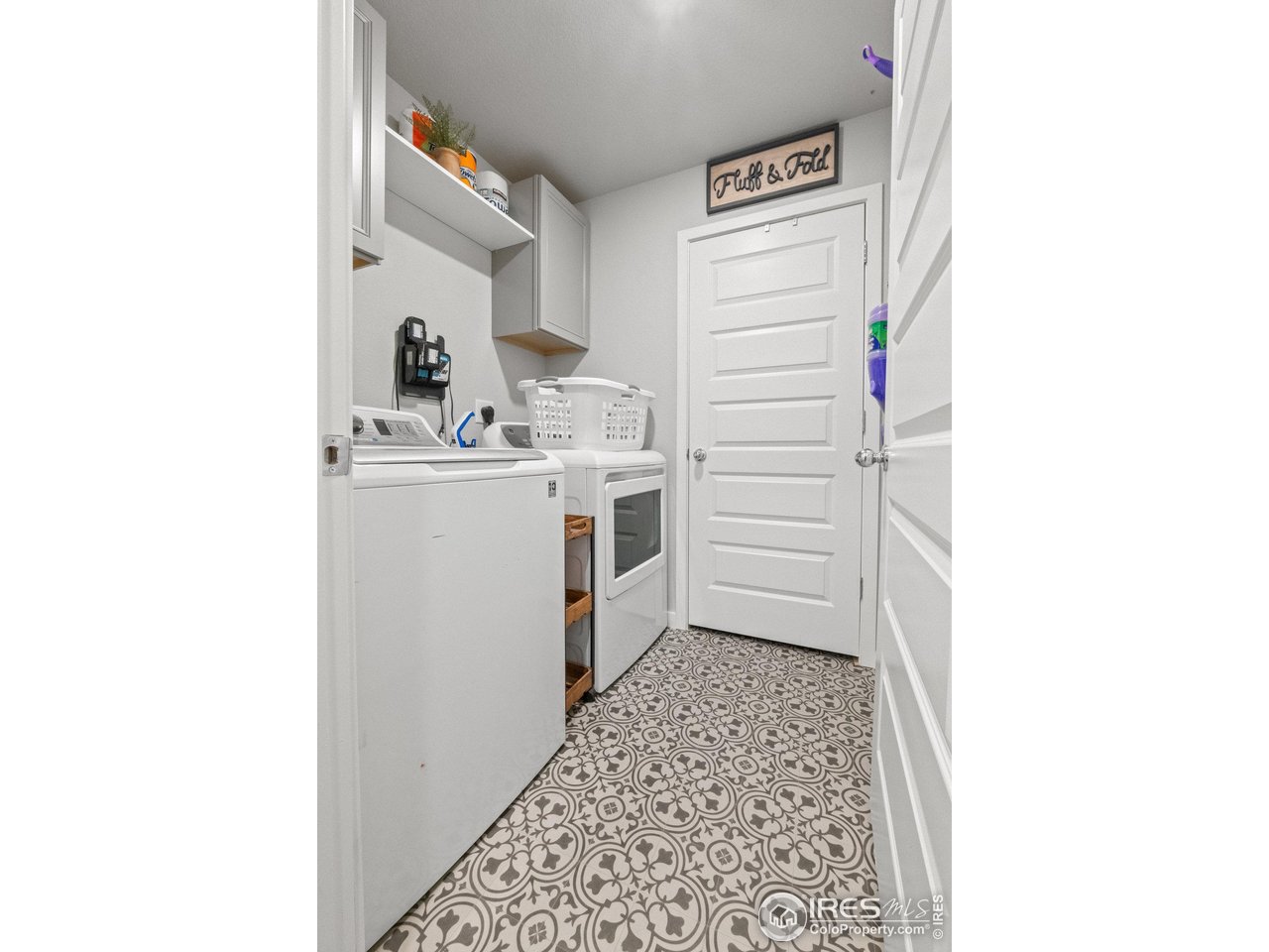 515 Wildcat Parkway Wiggins, CO 80654 - Photo 15 of 43 a kitchen with a refrigerator and a stove