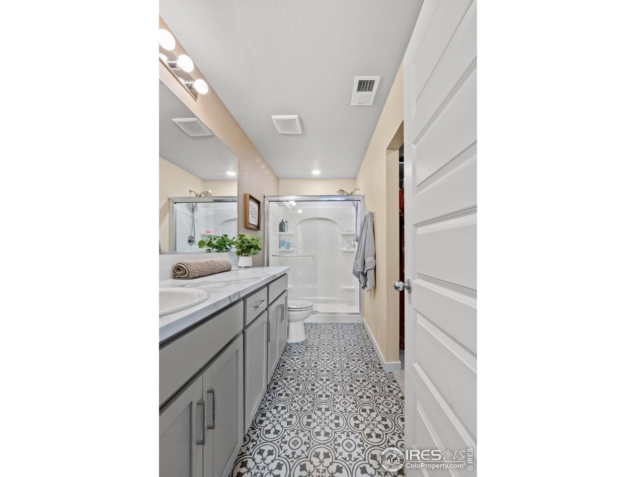 515 Wildcat Parkway Wiggins, CO 80654 - Photo 34 of 43 a bathroom with a sink and a mirror