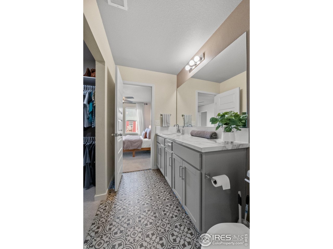 515 Wildcat Parkway Wiggins, CO 80654 - Photo 35 of 43 a bathroom with a sink a mirror and a toilet