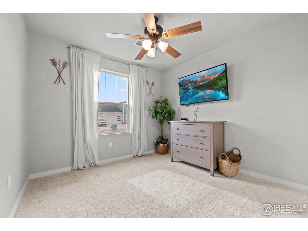 515 Wildcat Parkway Wiggins, CO 80654 - Photo 6 of 43 a view of livingroom with furniture and ceiling fan