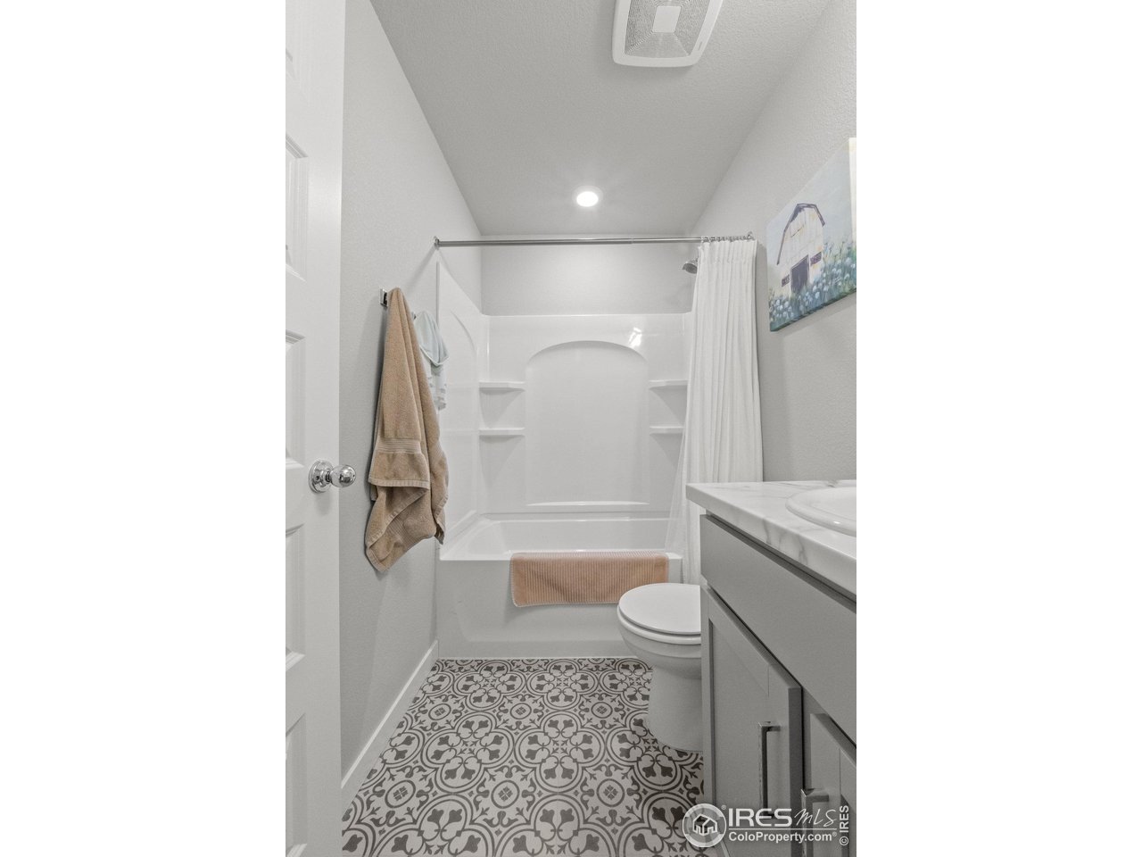 515 Wildcat Parkway Wiggins, CO 80654 - Photo 8 of 43 a bathroom with a toilet and a shower