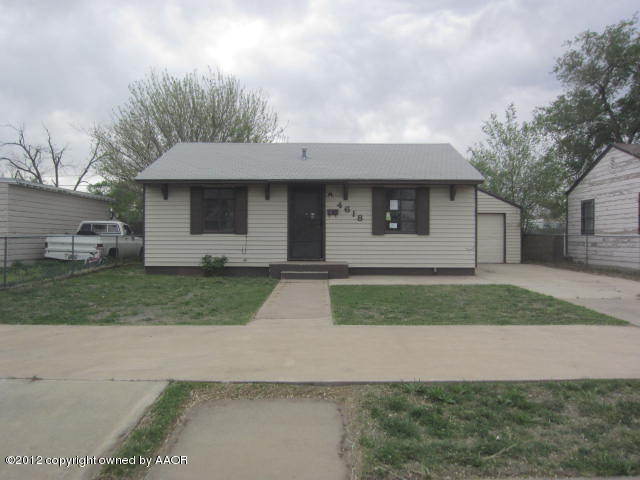 4618 Cline Road Amarillo, TX 79110 - Photo 1 of 10 a front view of a house with a yard and garage