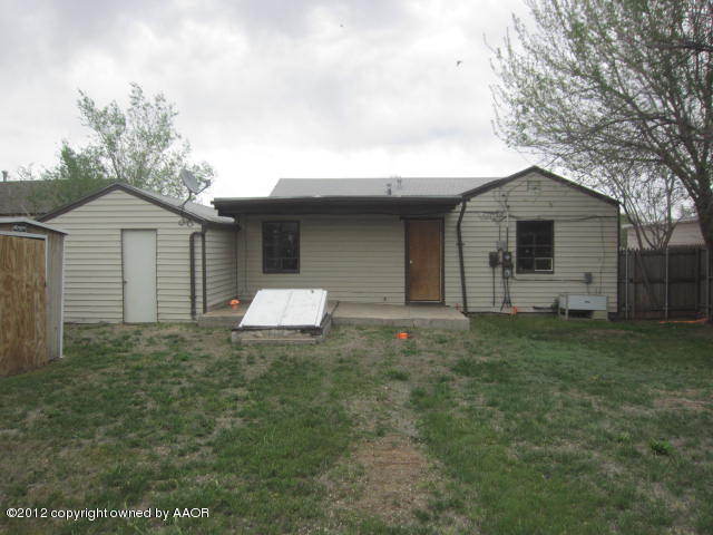 4618 Cline Road Amarillo, TX 79110 - Photo 2 of 10 a front view of a house with a yard and garage