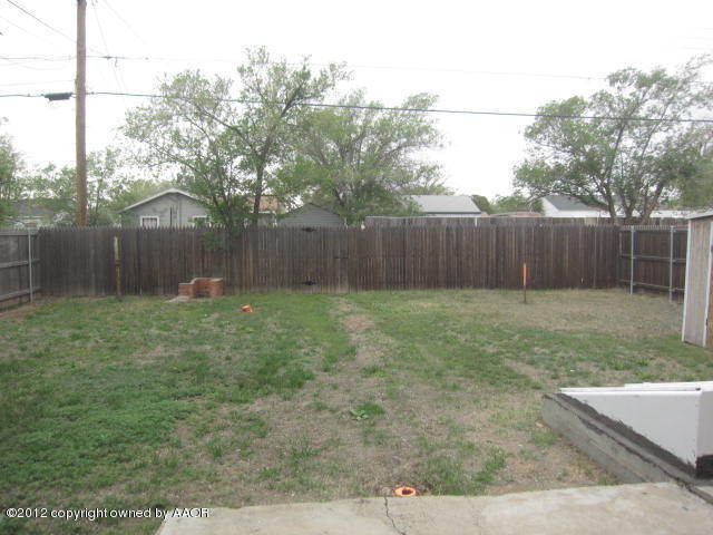 4618 Cline Road Amarillo, TX 79110 - Photo 3 of 10 a view of backyard with wooden fence
