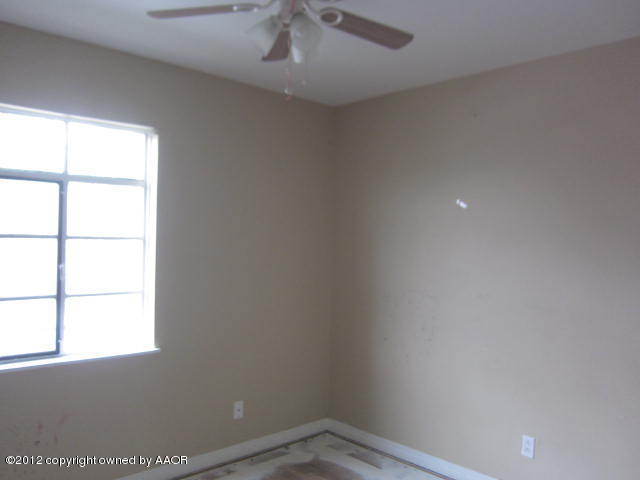 4618 Cline Road Amarillo, TX 79110 - Photo 9 of 10 an empty room with a window